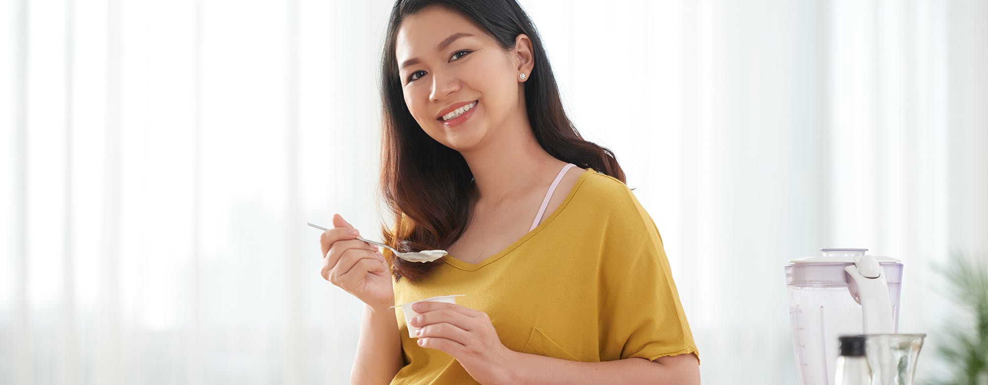 a pregnant woman eating a nutritious food