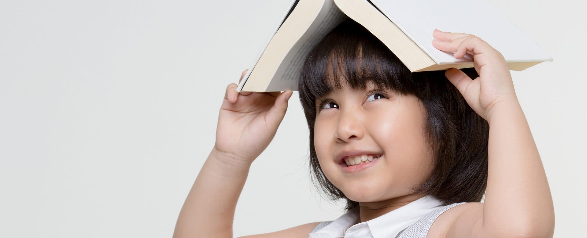 a children playing with her book