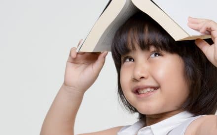 a children playing with her book