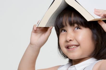 a children playing with her book