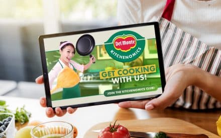 Woman hands showing digital tablet at kitchen