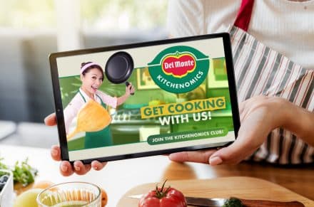 Woman hands showing digital tablet at kitchen